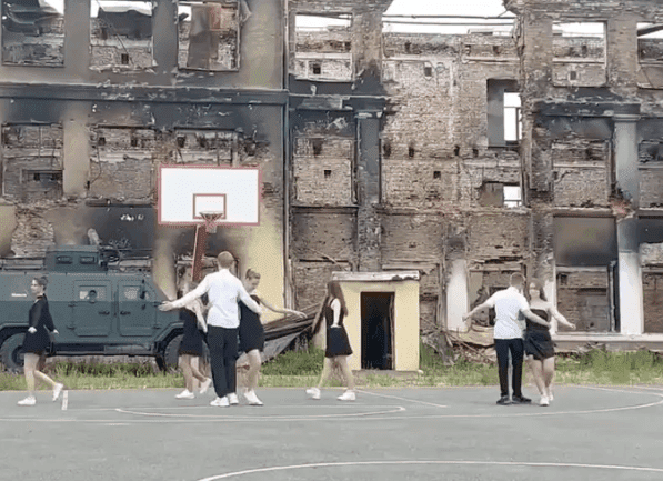 Kids dancing near their fully destroyed school _ Kharkiv _ Ukraine 2022